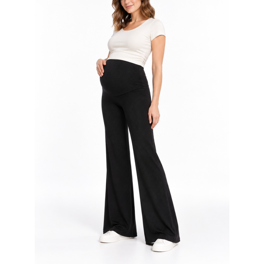 Angled front view of a pregnant model wearing Black maternity flare pants with a high waistband and a white fitted top.
