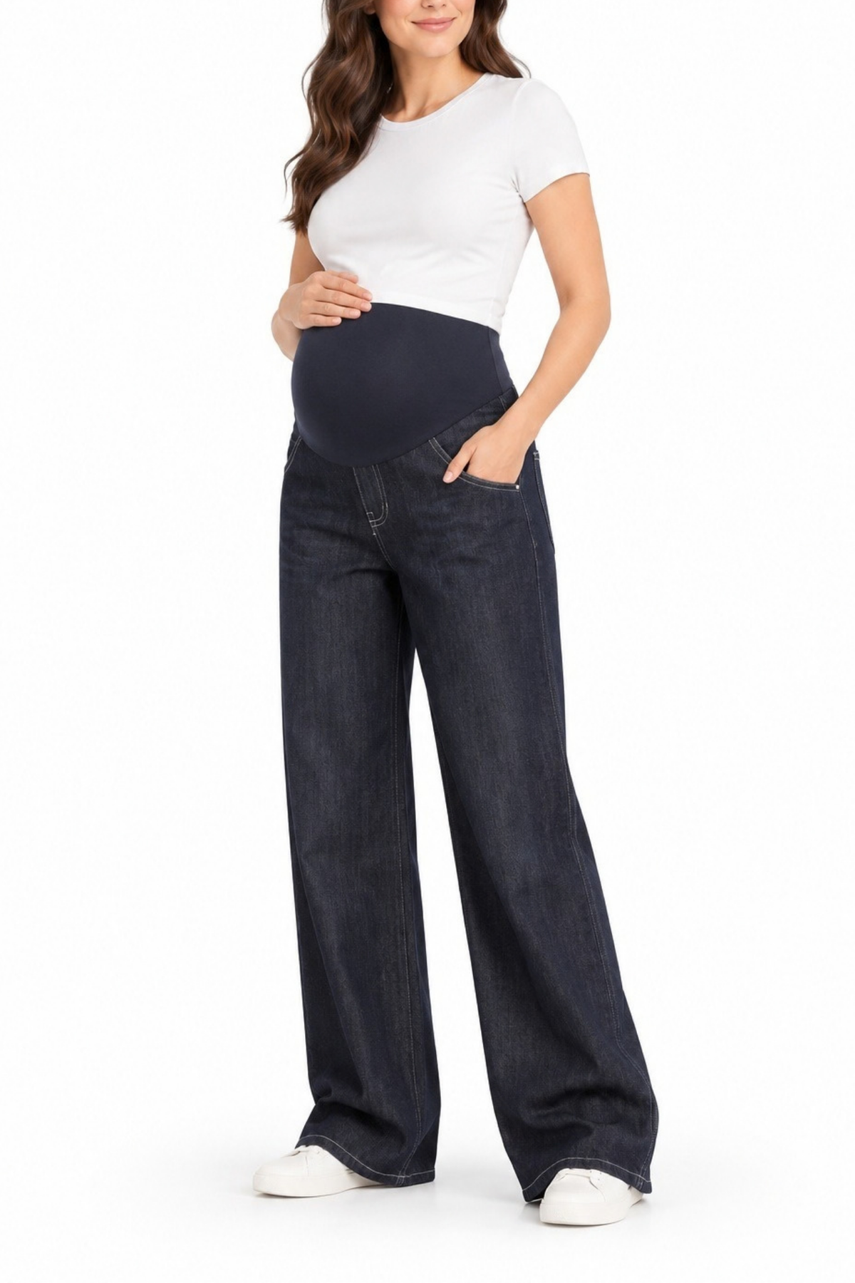 Angled front view of a pregnant model wearing dark-wash maternity wide-leg jeans with an over-belly panel and side pockets.