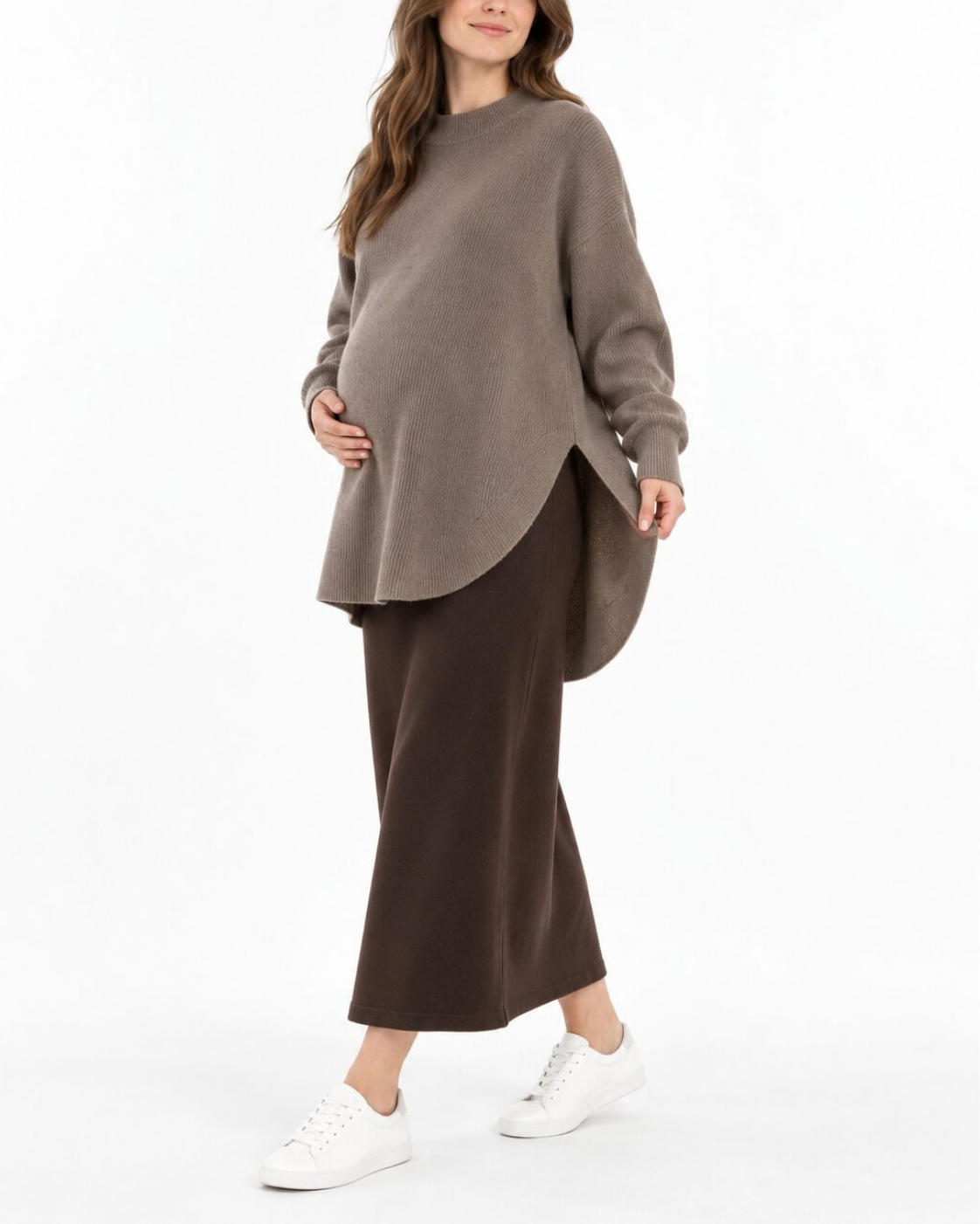 Angled side view of the taupe maternity long-sleeve top styled with a brown maxi skirt.