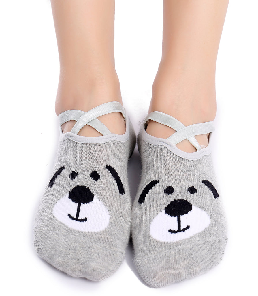 Gray ankle socks with cute animal face design and criss-cross straps, worn on feet against a white background.