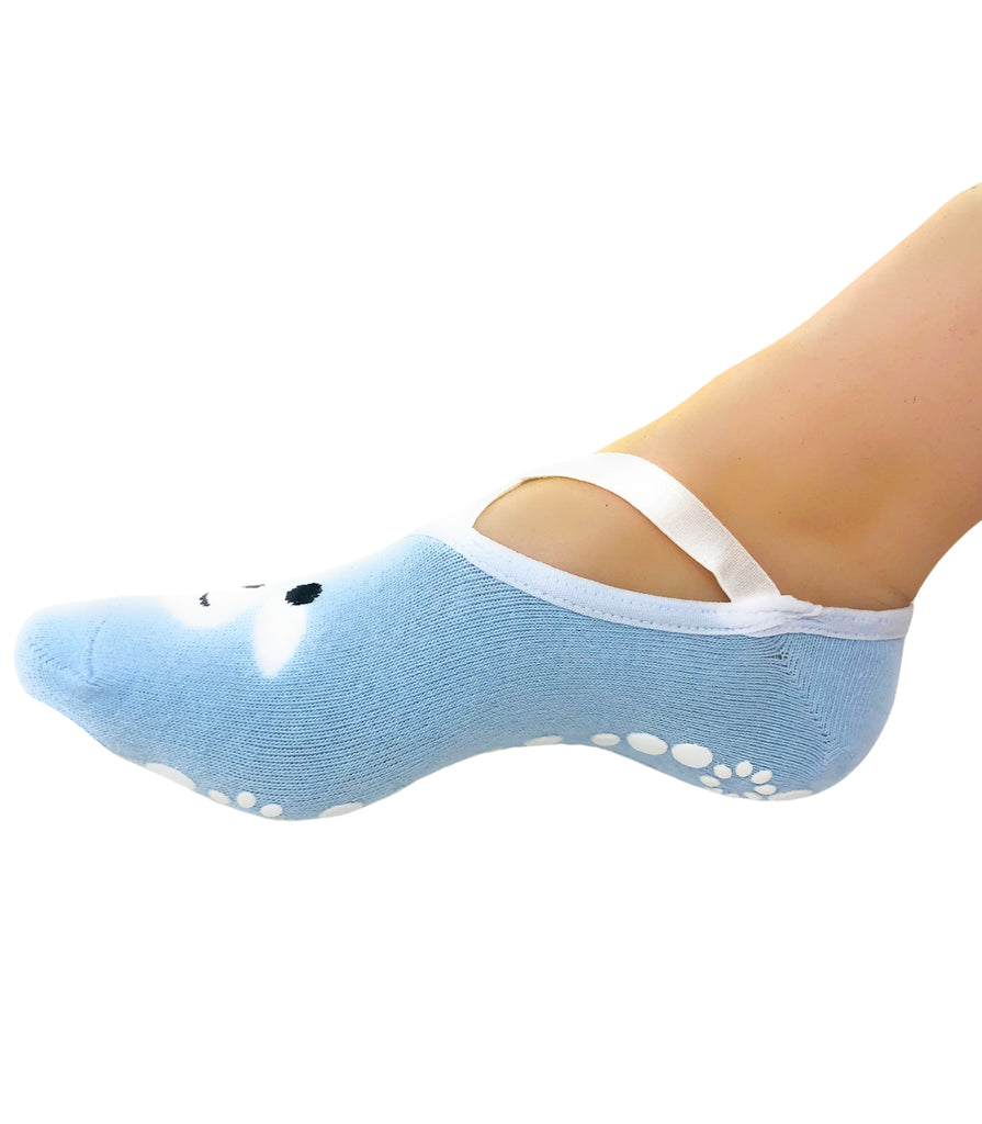 Blue non-slip ankle sock with a polar bear design and white strap on the foot.