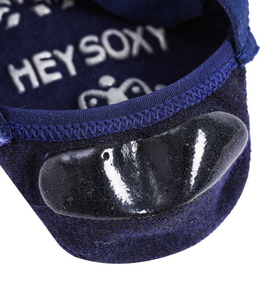 Blue no-show sock with a transparent gel grip patch and branding text reading "HEY SOXY" on the inner sole.