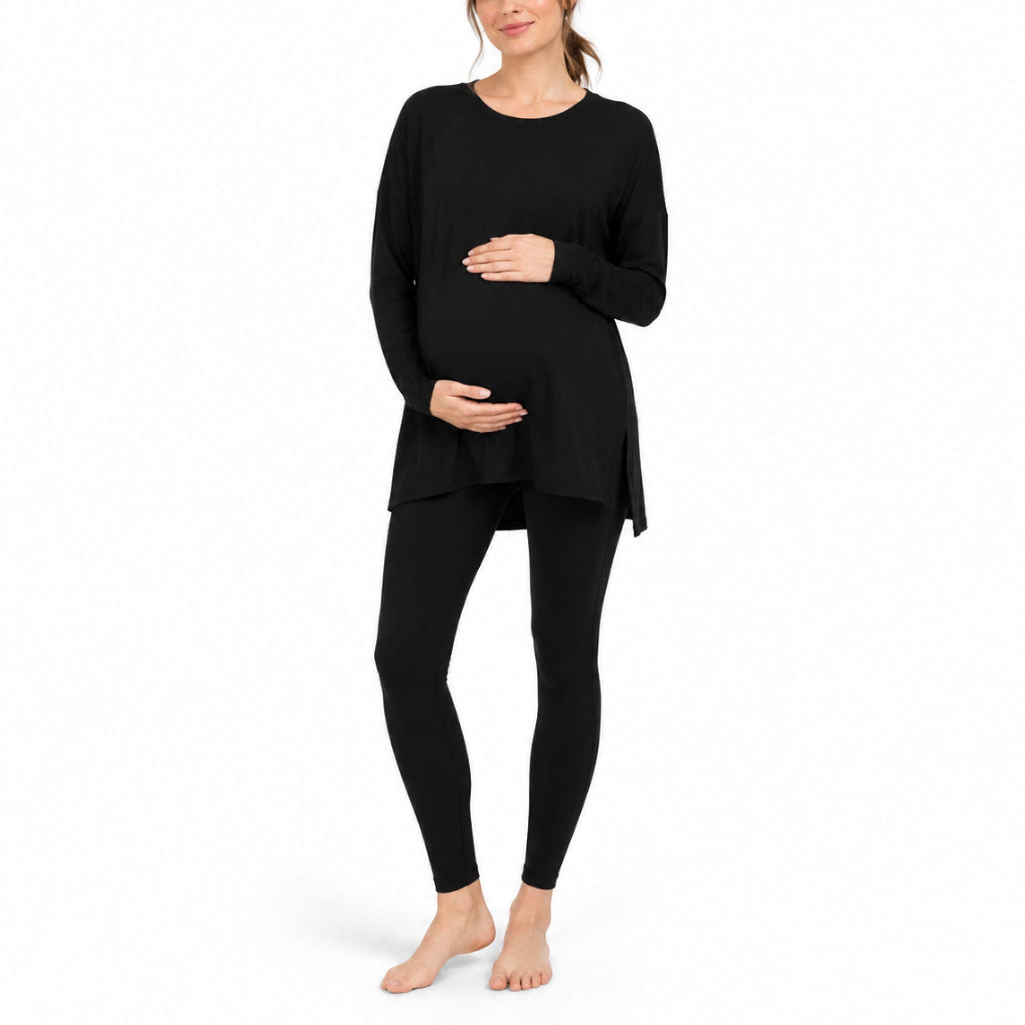 Black maternity two-piece set with a long-sleeve oversized longline top and coordinating leggings shown from the front on a pregnant model.