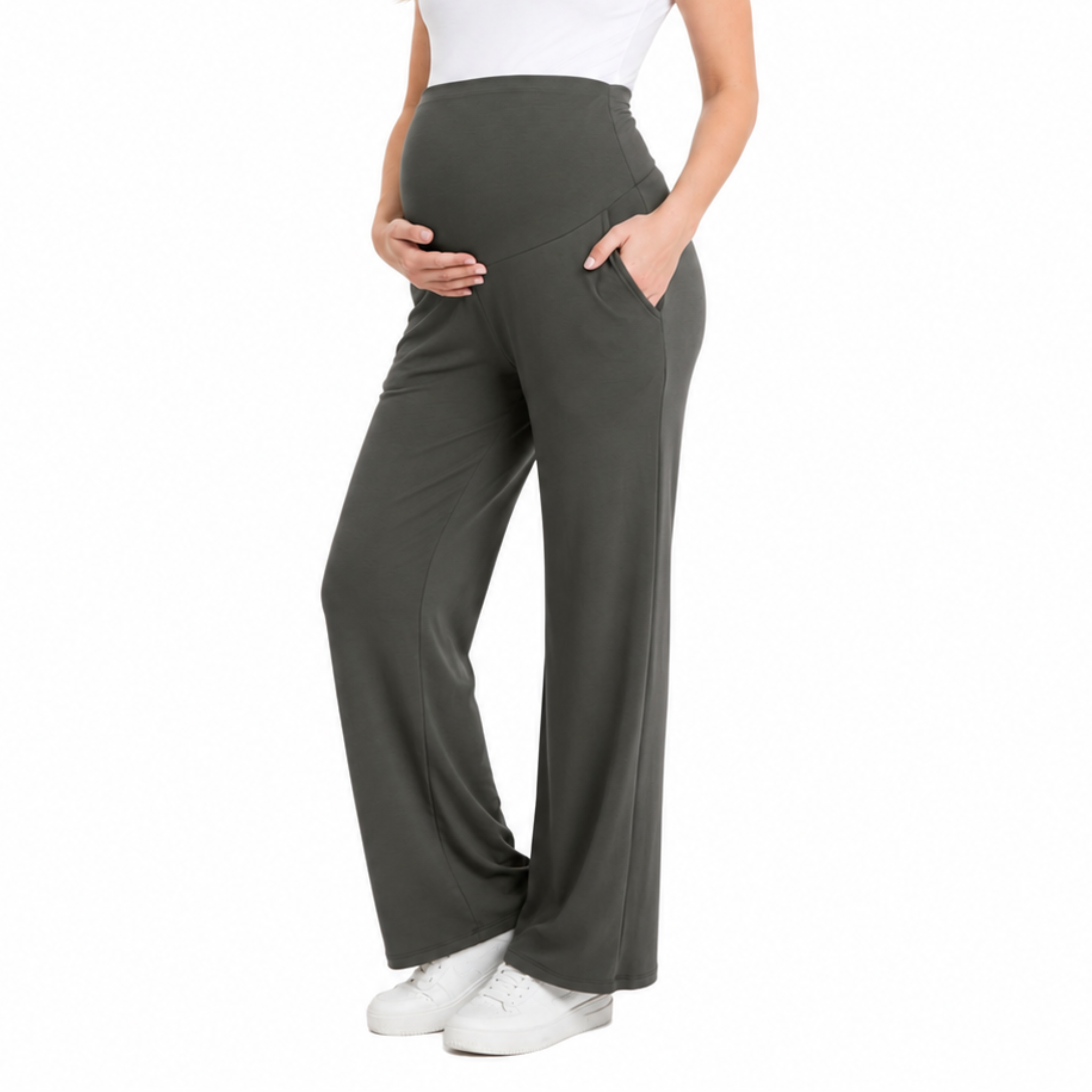 Pregnant model wearing gray maternity yoga pants with a built-in bellyband, relaxed wide-leg silhouette, and side pockets, shown from the front.